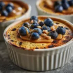 Baked protein pancake bowl topped with blueberries and cinnamon