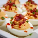 Spicy Deviled Eggs with Turkey Bacon and Sriracha – The Bold High-Protein Snack You’ll Crave 8 Creamy spicy deviled eggs with turkey bacon and sriracha drizzle