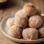Crispy cinnamon sugar protein donut holes air fryer on a plate