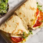 2-Ingredient Cottage Cheese Flatbread (Air Fryer Friendly & High Protein) 11 folded simple cottage cheese flatbread air fryer wraps with tomato and sprouts