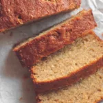 Moist Protein Banana Bread (No Blender, 1 Bowl Recipe!) 9 Close-up of sliced protein banana bread on parchment