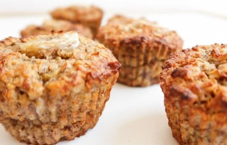 Healthy Banana Oatmeal Muffins 4 Healthy banana oatmeal muffins with oats and ripe bananas for a nutritious snack.