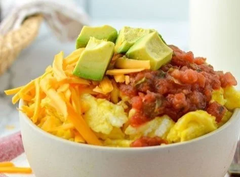 Delicious breakfast burrito bowl topped with fresh ingredients and served in a bowl